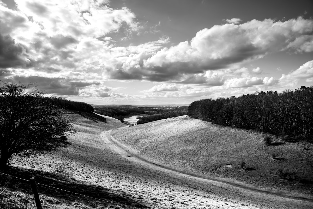 photo of a valley with a moody sky